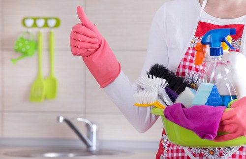 Reliable cleaners in Harrow vacuuming and dusting a family home