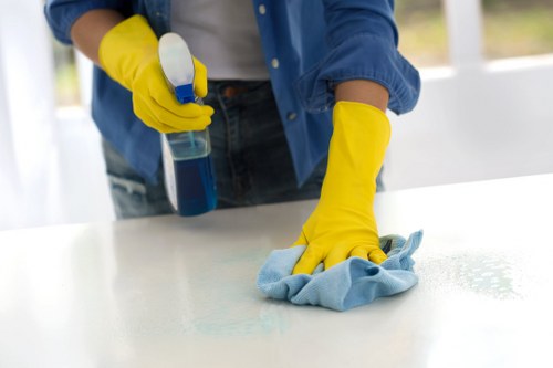 Cleaning operative following a health and safety policy during daily work