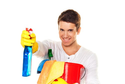 Technician performing sofa cleaning on a modern corner sofa in Harrow